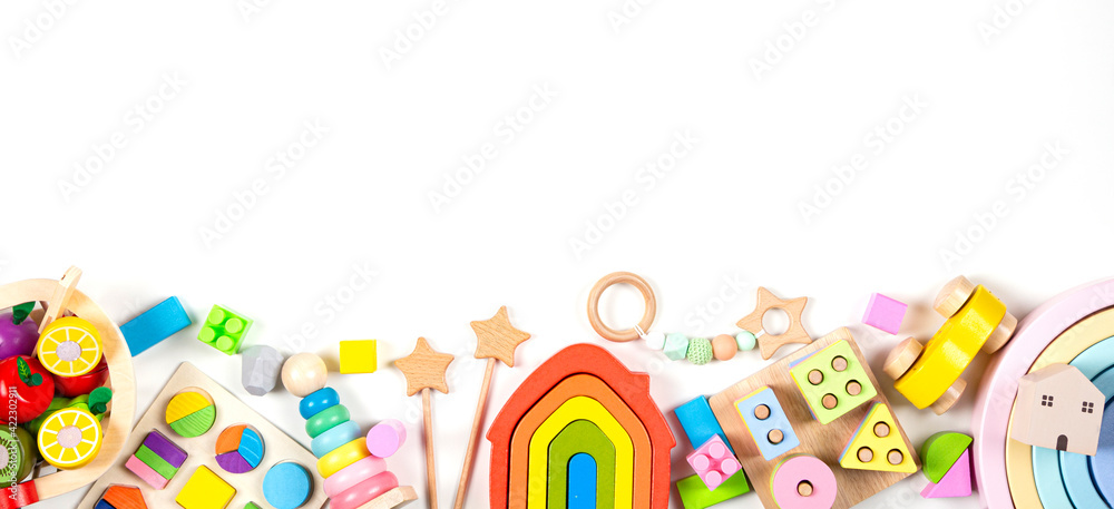 Baby kids toy banner background. Colorful educational toys on white background. Top view, flat lay, copy space for text