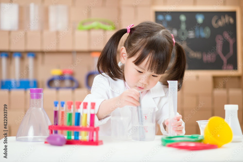 young girl plays  science experiment for home schooling
