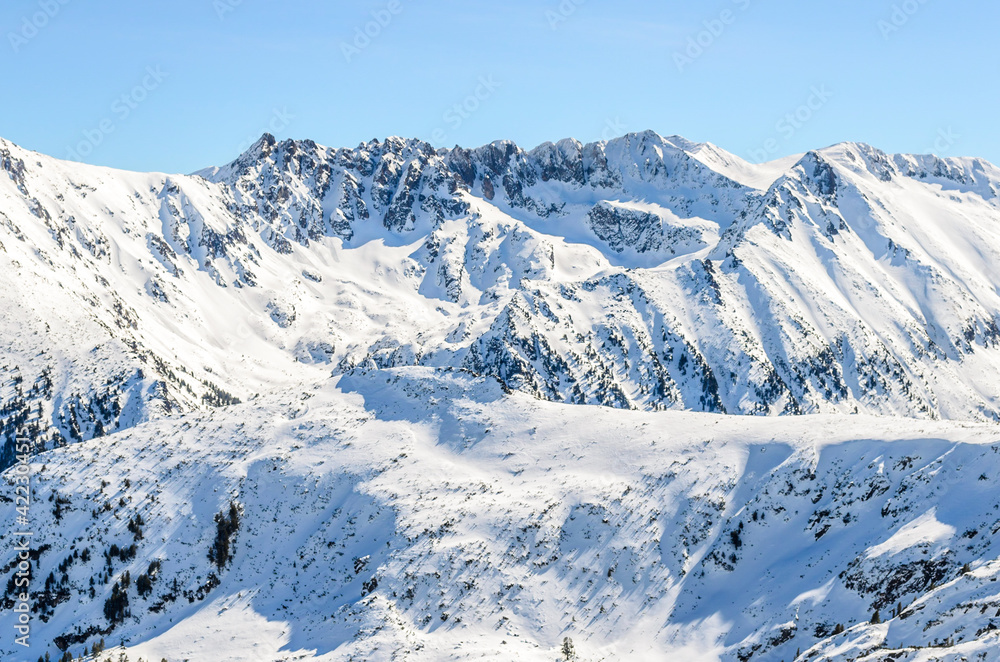 Winter landscape, Snowy Mountain Range, Mountain Tops, Bansko, Bulgaria, Europe, Natural Winter Scenery. Winter landscape, Snowy Mountain Range, Mountain Tops, Bansko, Bulgaria, Europe, Natural Winter Scenery.