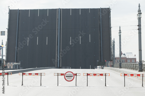 Raised span of drawbridge. Blagoveshchensky Bridge photo