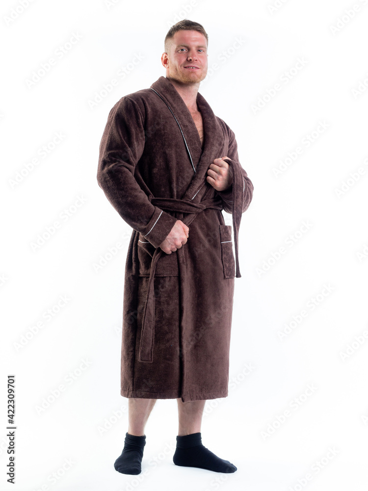 strong man in a Bathrobe on an isolated white background with a smile on his face.