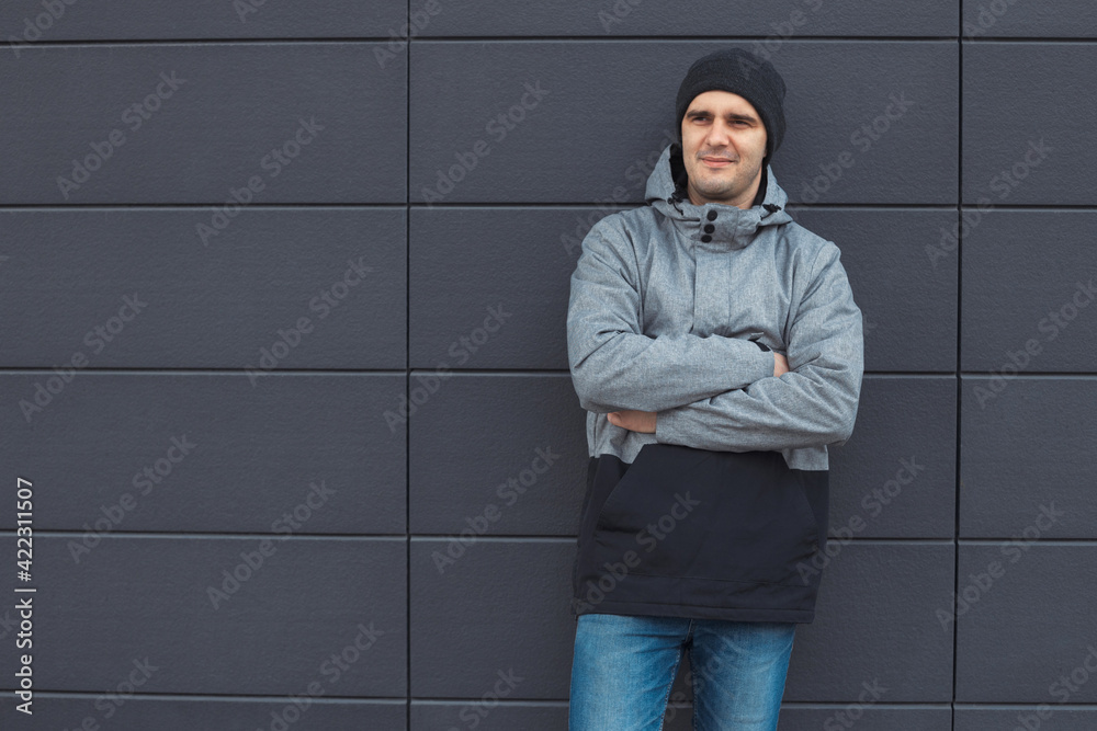 Closeup portrait of handsome 30-35 years old man outdoors standing near the wall Closeup portrait of handsome 30-35 years old man outdoors standing near the wall