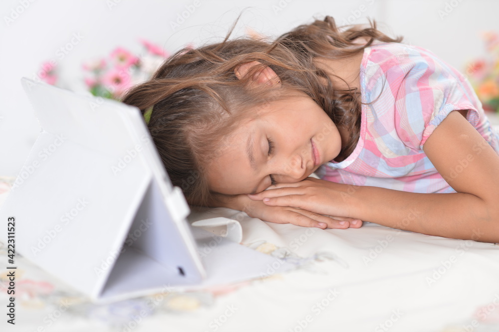 Portrait of Beautiful little girl with tablet pc sleeping Portrait of Beautiful little girl with tablet pc sleeping