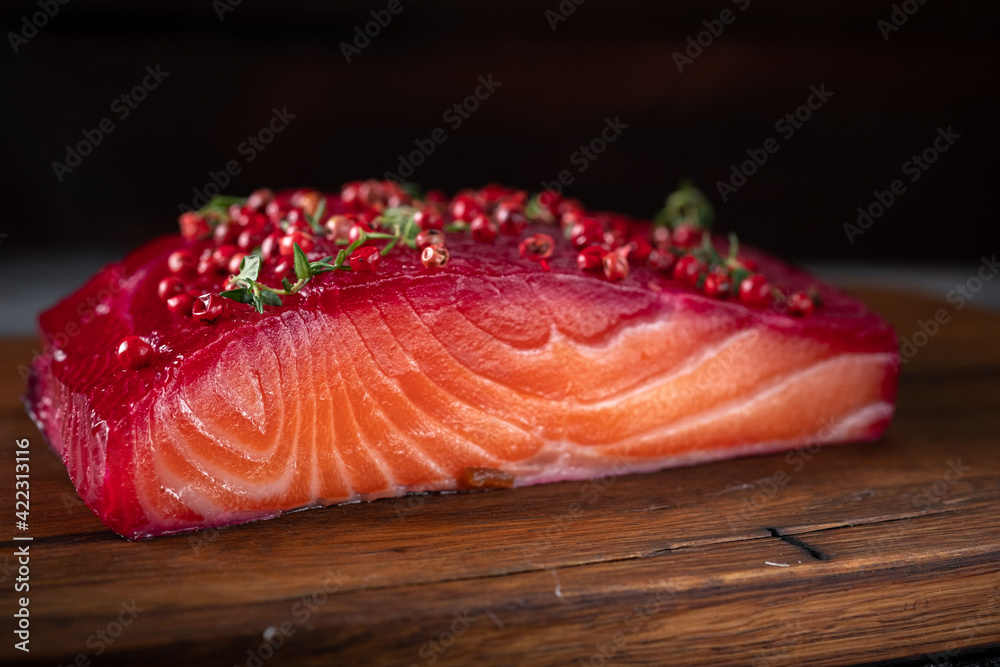 Φωτογραφία Smoked salmon fillet in one piece with herbs and berries in Scandinavian style o