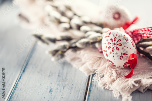Photography Handmade easter eggs with willow catkins on a linen napkin