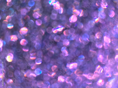 Abstract colorful purple and silver small bokeh Look bright effect texture on black background. glitter vintage lights defocused elegant for cosmetics or celebrate. Sparkling magical dust particles. © warin