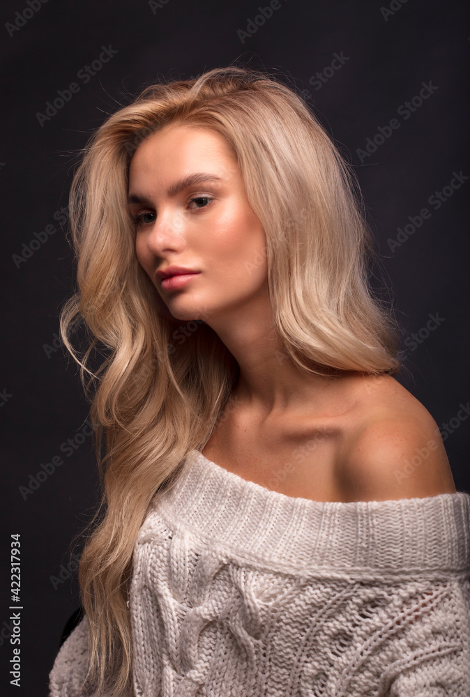 Blonde, studio portrait of a young girl
Blonde, studio portrait of a young girl