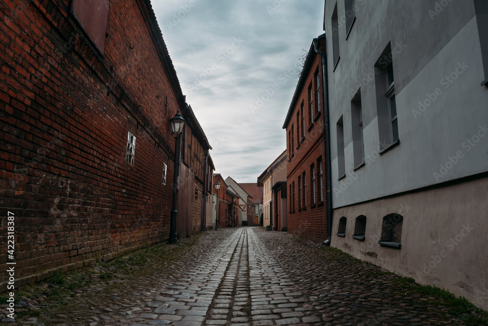 A small narrow alley in an old village in Beelitz, Brandenburg, Germany