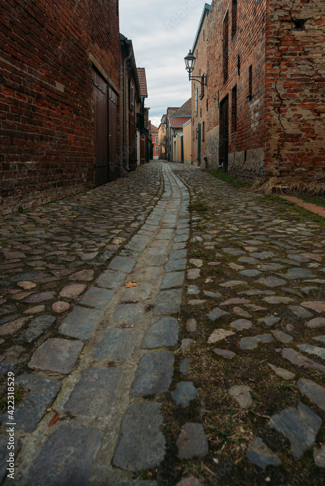 A small narrow alley in an old village in Beelitz, Brandenburg, Germany