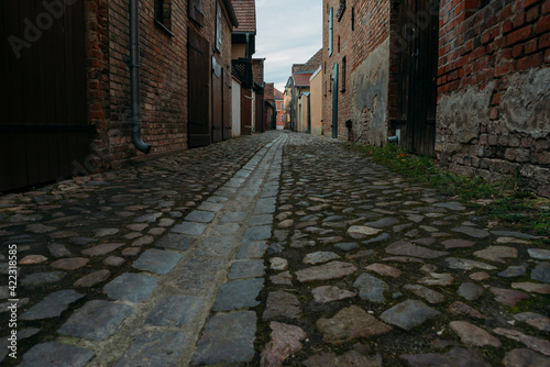 A small narrow alley in an old village in Beelitz, Brandenburg, Germany