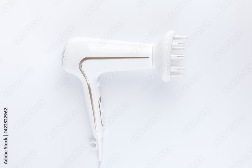 Hairdryer with a diffuse styling attachment on a white background