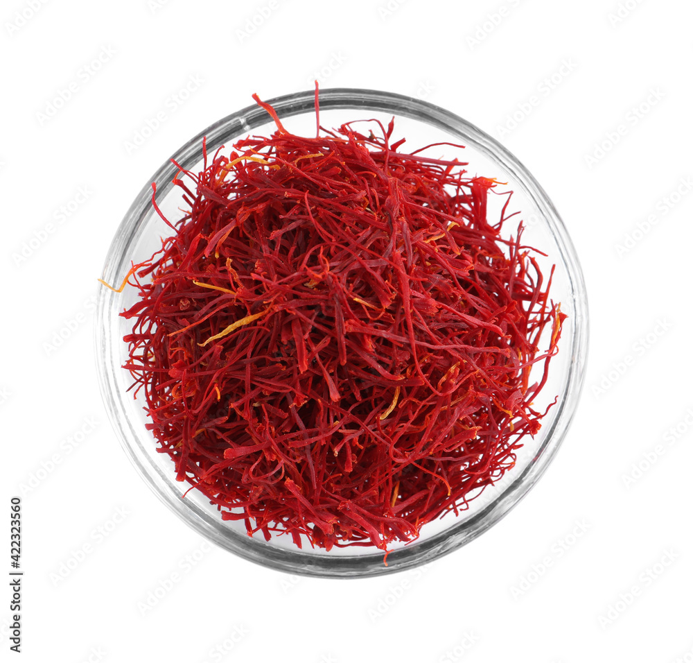 Fototapeta premium Aromatic saffron in glass bowl isolated on white, top view