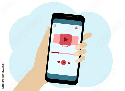 Hand with a mobile phone. There is a video player symbol in the phone