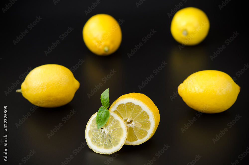 appetizing bright lemons on a black background contrasting colors Illuminating yellow on a black appetizing bright lemons on a black background contrasting colors Illuminating yellow on a black