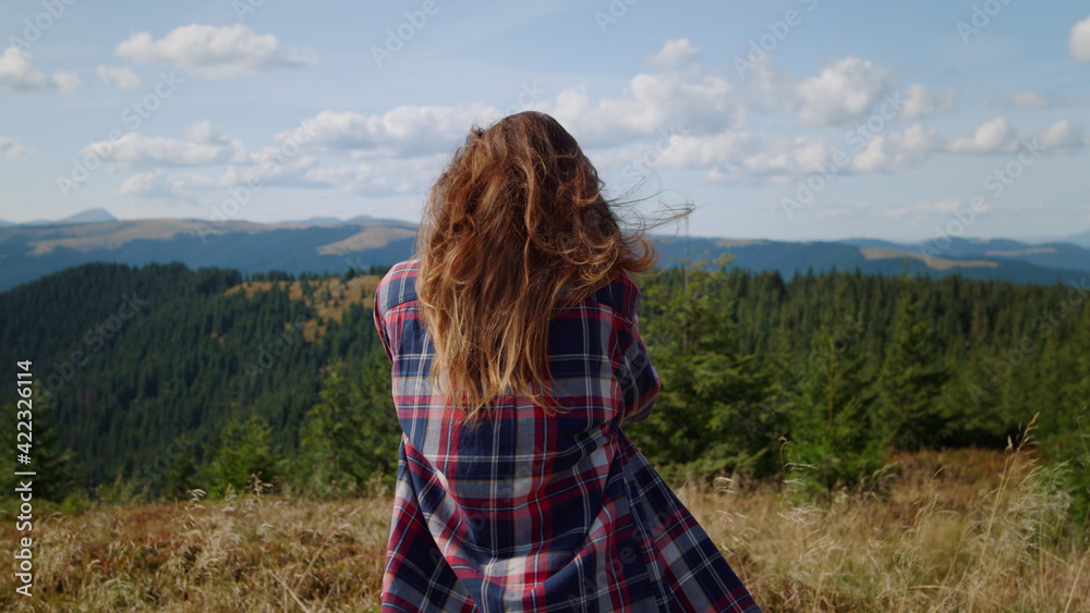 Woman taking photos of mountains on photo camera. Photographer looking pictures Woman taking photos of mountains on photo camera. Photographer looking pictures