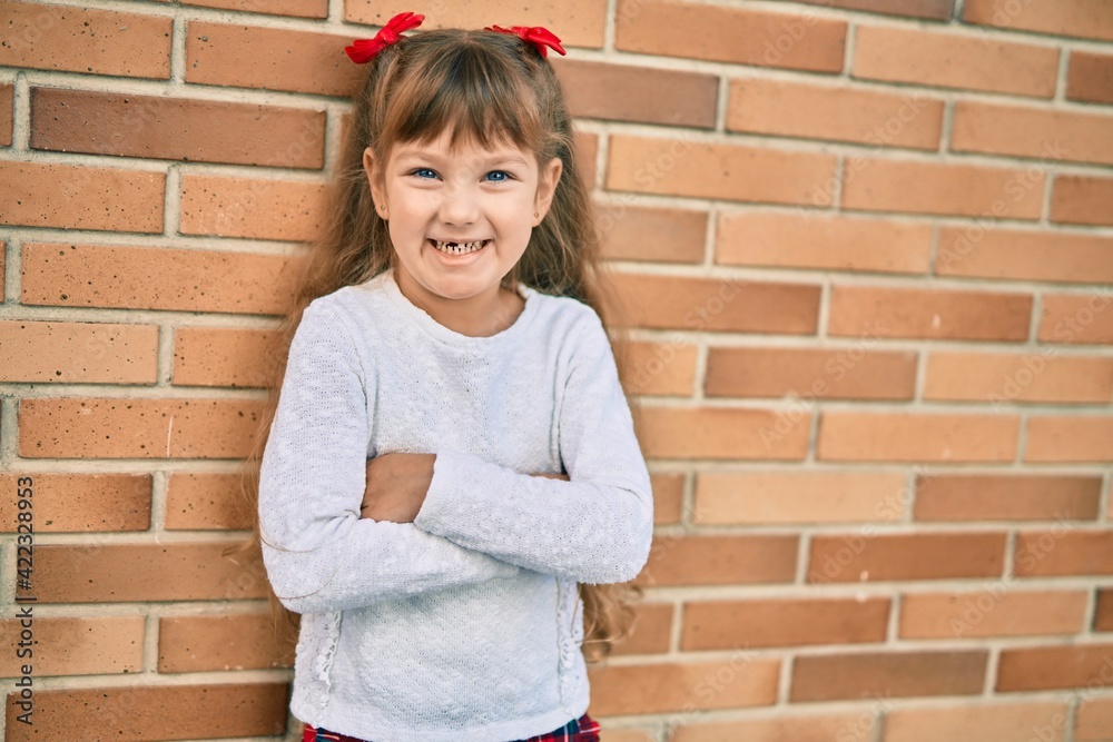 Adorable caucasian child girl smiling happy standing at the city. Adorable caucasian child girl smiling happy standing at the city.