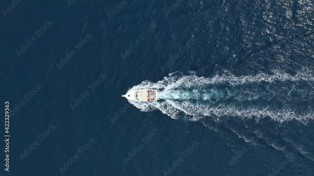 Croatia. Summer. Aerial view of floating yacht on blue Adriatic sea at sunny day.  Sail boat on sea surface. Seascape from drone. Travel and vacation video