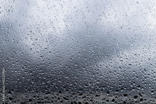 Water drops on window glass  closeup. Rainy weather