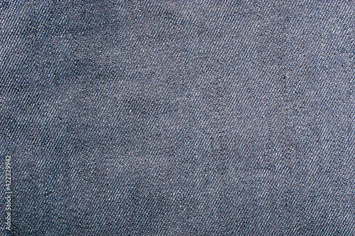 Blue and white jeans fabric texture. Pattern of rough cotton canvas.