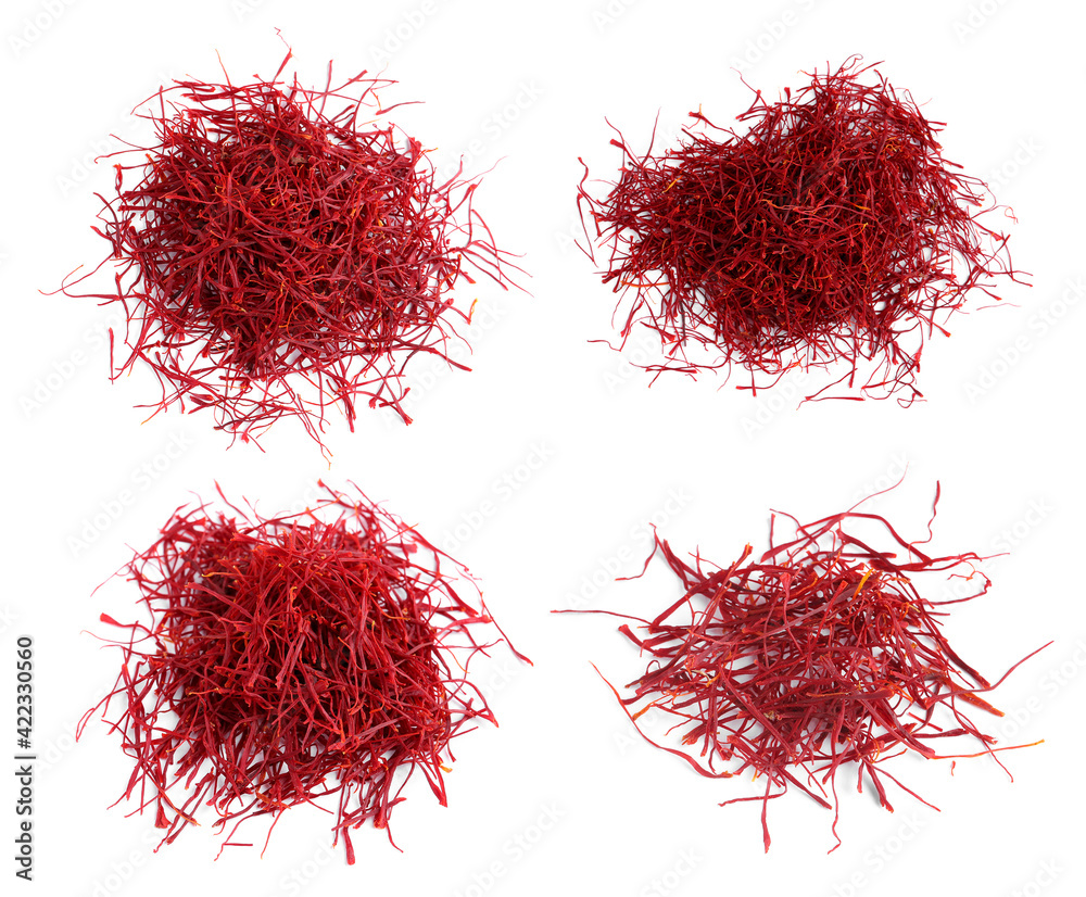 Naklejka premium Set with dried saffron on white background, top view