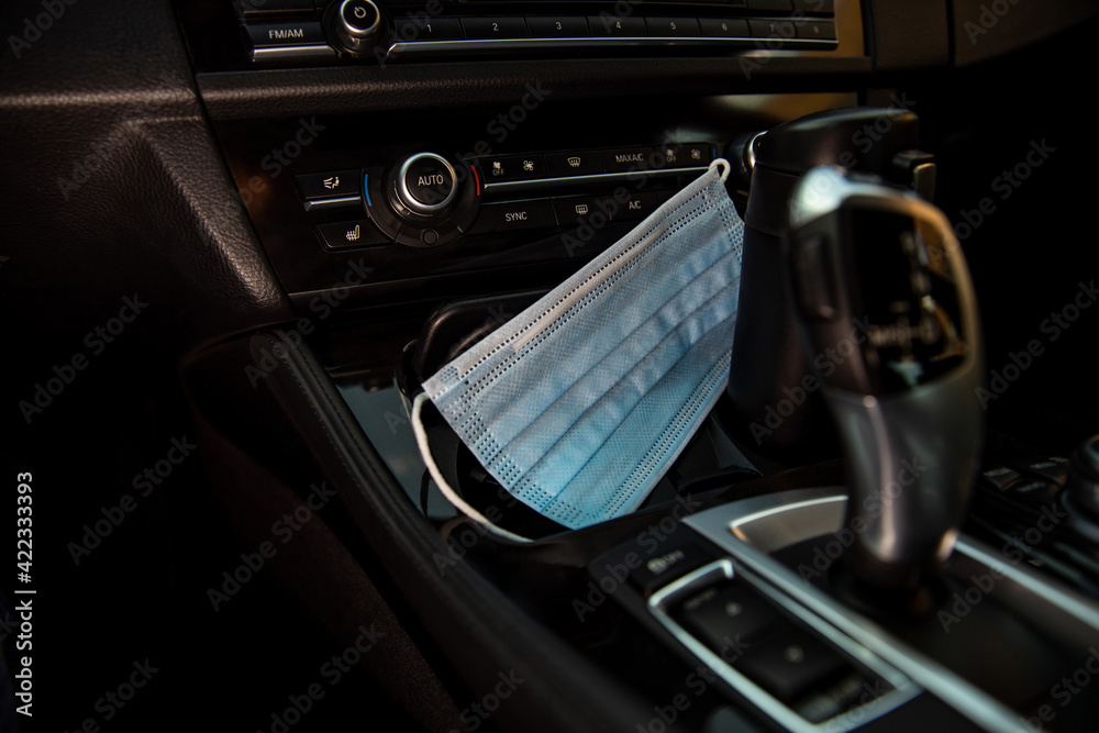 Medical Face masks inside a car.
Surgical mask in Car.