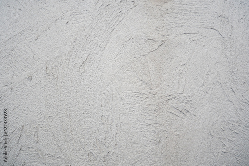 Decorative plaster. Grey wall texture background. Concrete style. Restoration indoors. Maintenance works. Renovation at home.