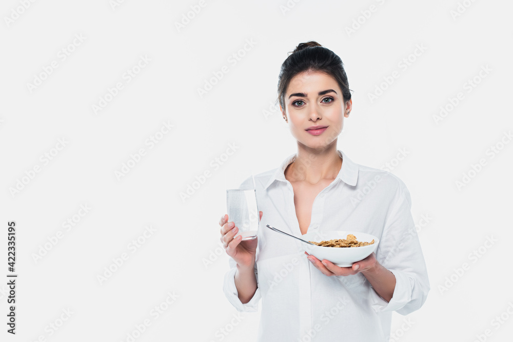 Woman holding bowl with cereals and water isolated on white Woman holding bowl with cereals and water isolated on white