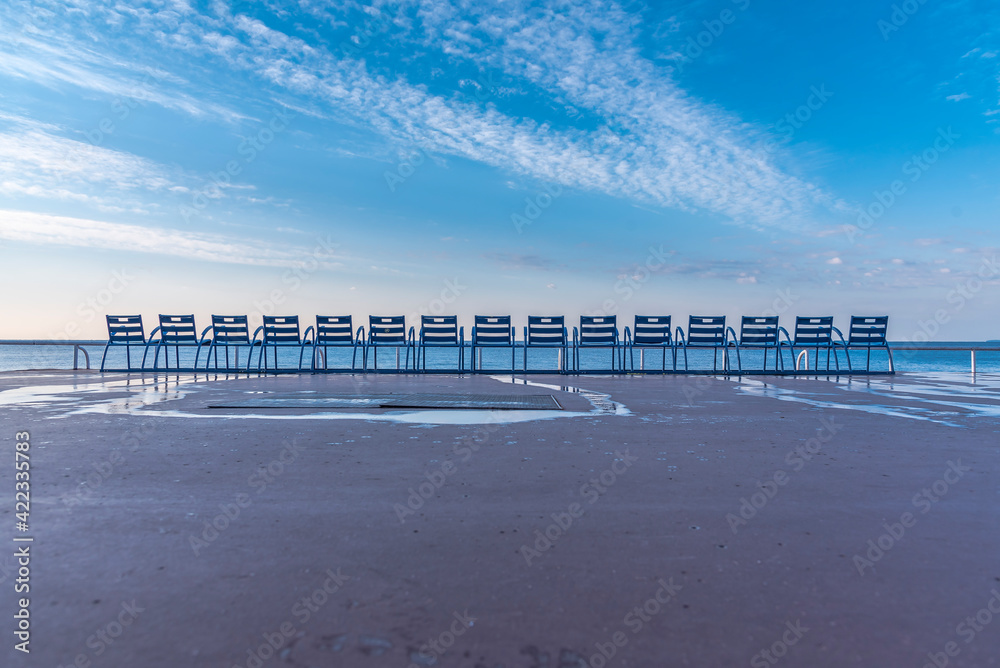 row of blue chairs in nice