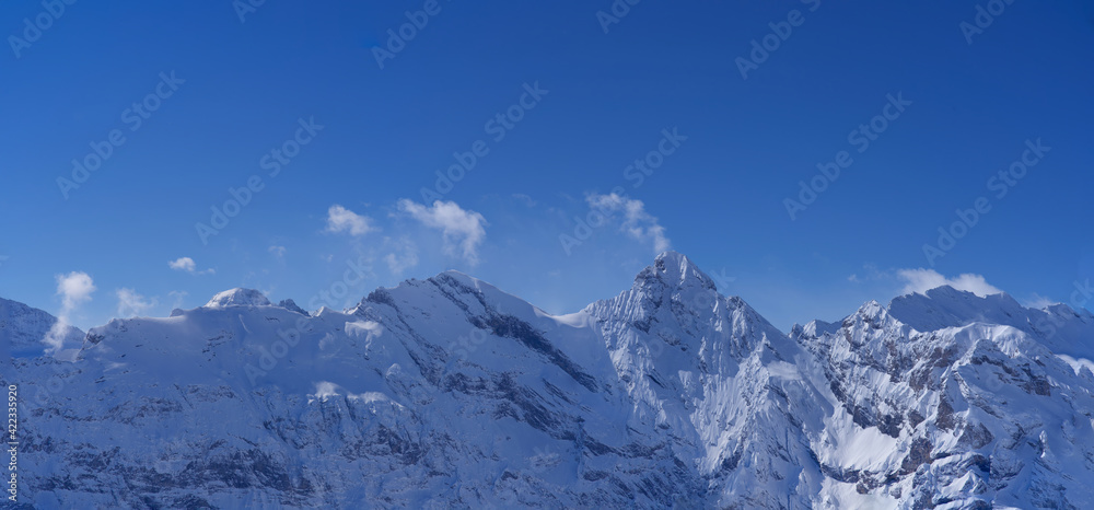 Mountain panorama of the Bernese Alps. Seen form mountain peak Piz Gloria, Schilthorn, Switzerland.