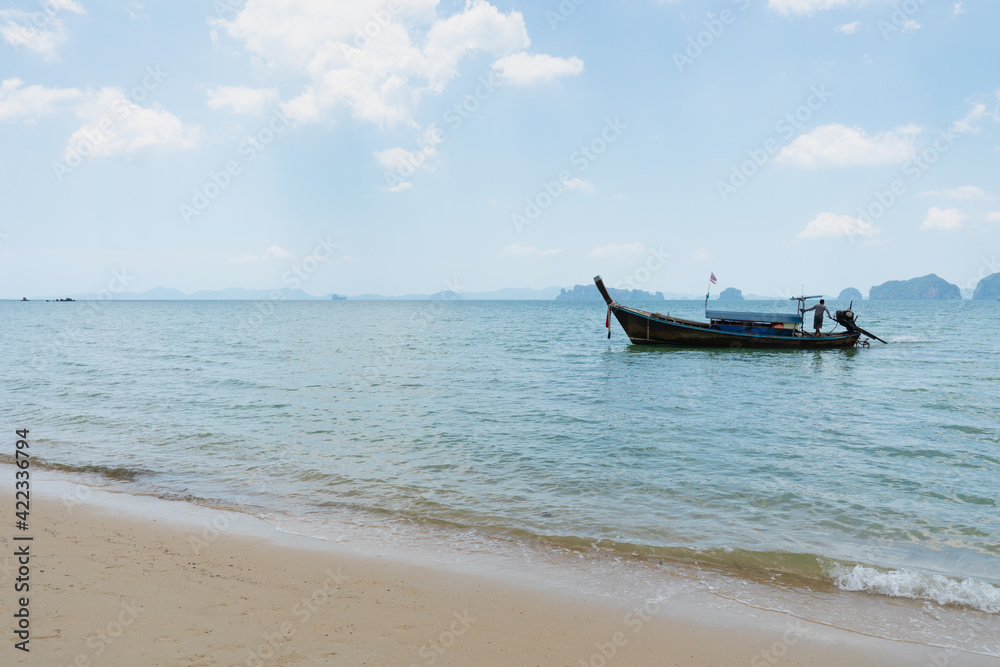 landscape of long tail boat on the blue sea with white sand in summer landscape of long tail boat on the blue sea with white sand in summer