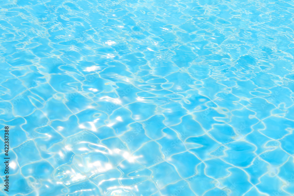 Blue water in pool for abstract background or Swimming pool rippled.