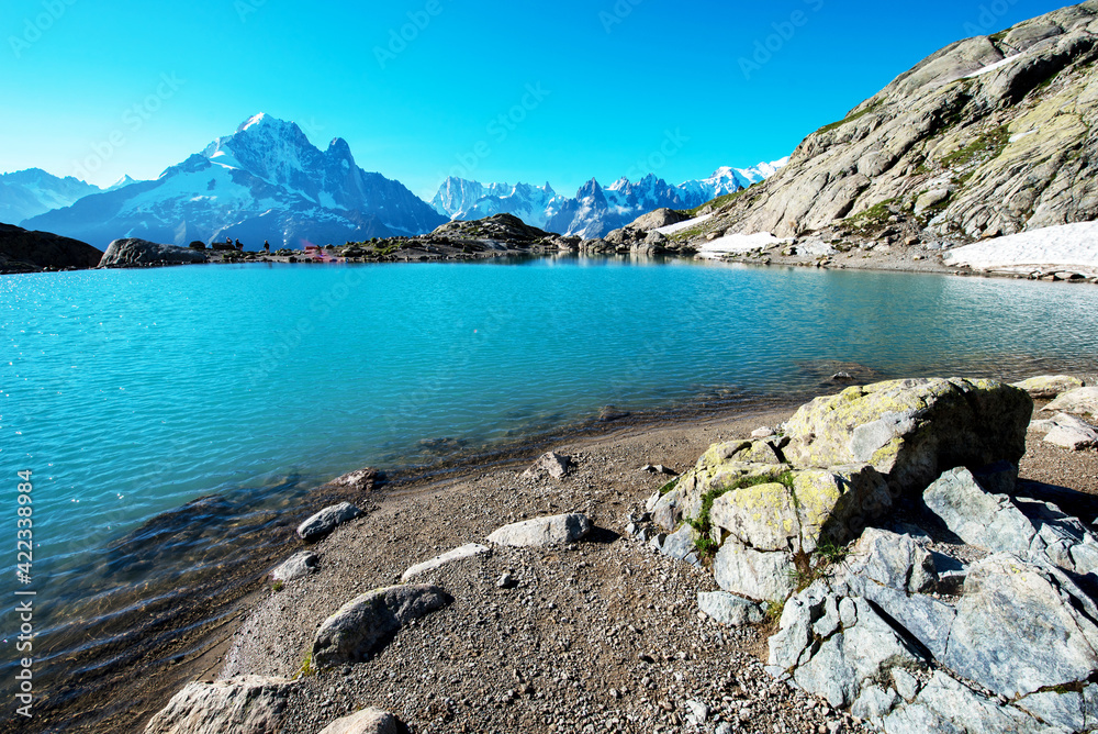 Beautiful mountain landscape with stones and nice lake in French Alps, massif La Blanc. (Harmony, tourism, meditation - concept)