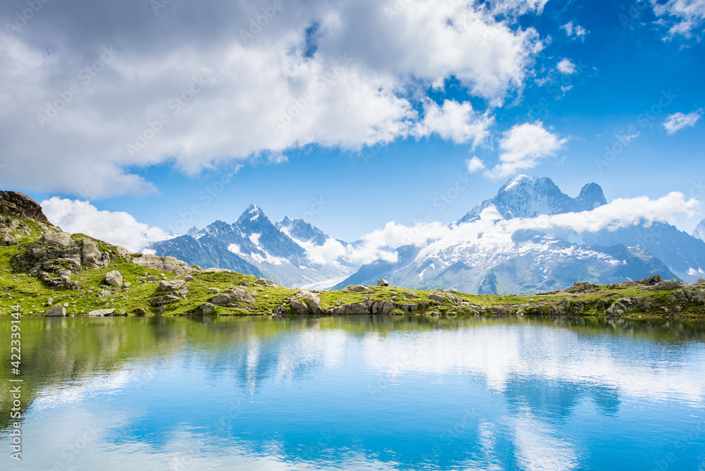 Fantastic landscape with reflection of mountains in the lake on the background of Mont Blanc, French Alps, Europe. (Harmony, tourism, meditation - concept)