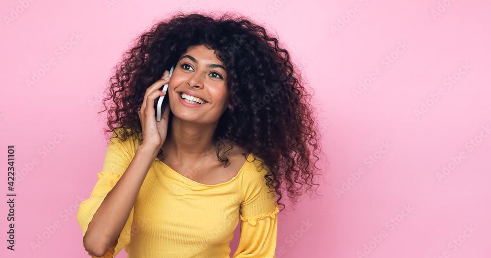 happy young woman talking on smartphone isolated on pink happy young woman talking on smartphone isolated on pink