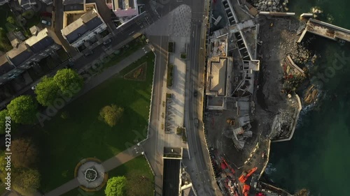 Dun Laoghaire Rathdown, Dublin, Ireland, April 2020. Drone, Birds Eye view tracking Dart railway line from People's Park, passing Lexicon, Pavillion, Town Hall, and culminating at Dart station. photo