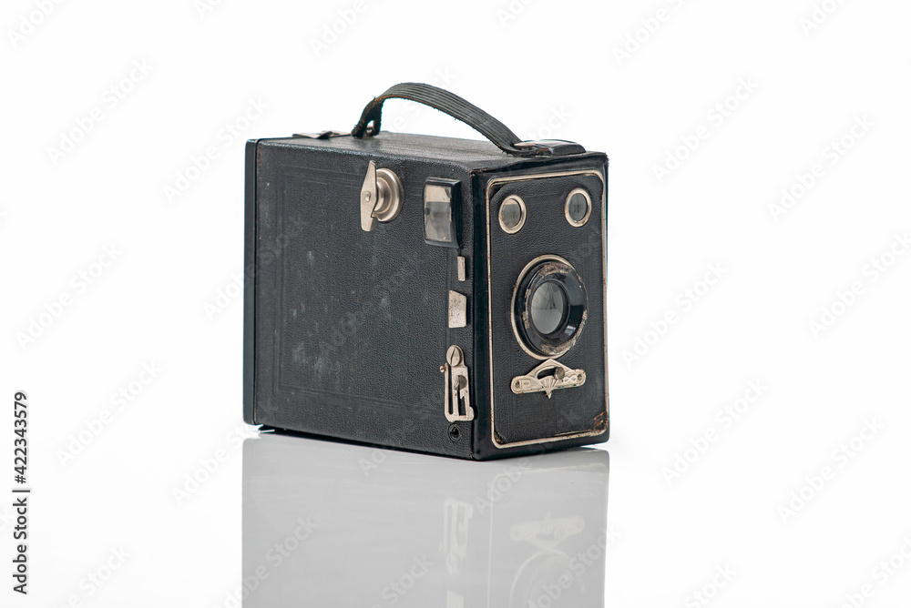Vintage camera isolated on a white background with reflection