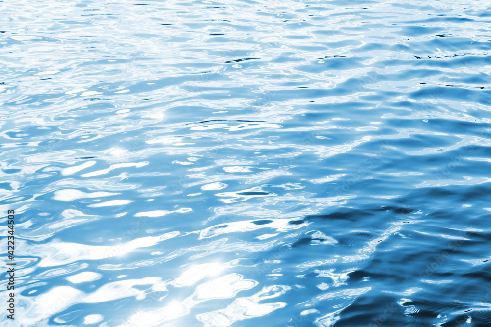 Ripples on lake water. Sunlight reflecting in water. Sun shining by the lake. Ocean wave background. Wavy pond texture. Messy water flow. Blue water surface background. Sky reflection pattern. Ripples on lake water. Sunlight reflecting in water. Sun shining by the lake. Ocean wave background. Wavy pond texture. Messy water flow. Blue water surface background. Sky reflection pattern.