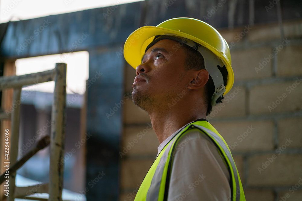 Foreman working in modern house building with notebook Foreman working in modern house building with notebook