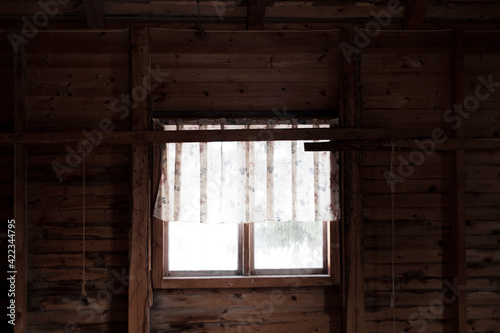 Window in old wooden house with