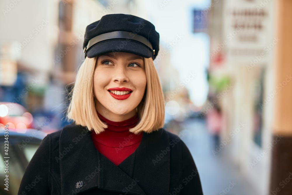 Young blonde woman smiling happy standing at the city. Young blonde woman smiling happy standing at the city.