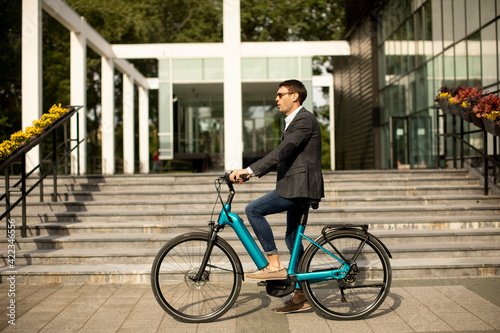 Young businessman on the ebike
