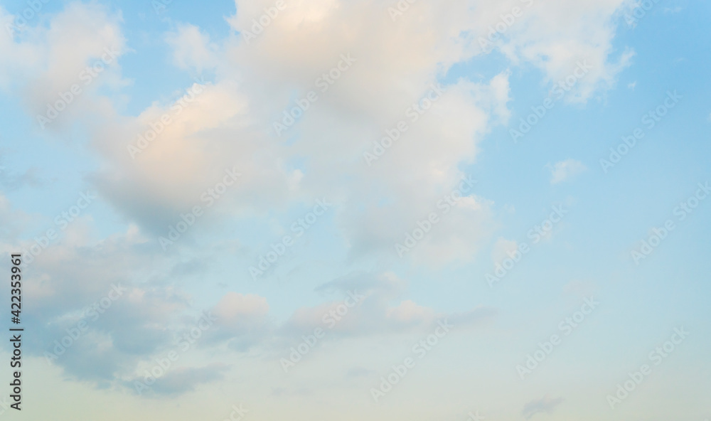 Obraz premium Beautiful view of blue sky with clouds at sunrise. Partly cloudy. Colorful sunset. Natural sky background texture, beautiful color.