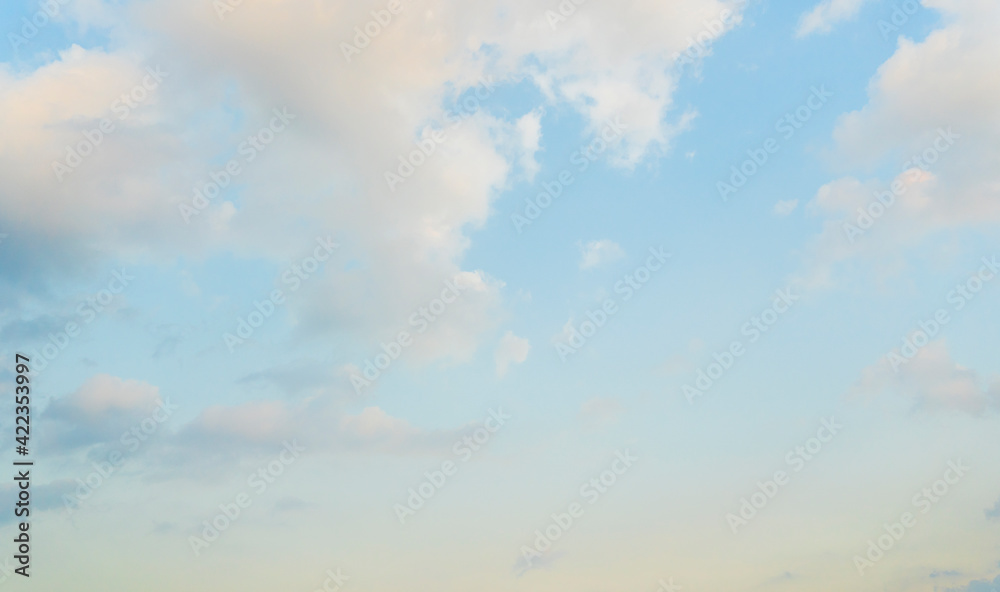 Obraz premium Beautiful view of blue sky with clouds at sunrise. Partly cloudy. Colorful sunset. Natural sky background texture, beautiful color.