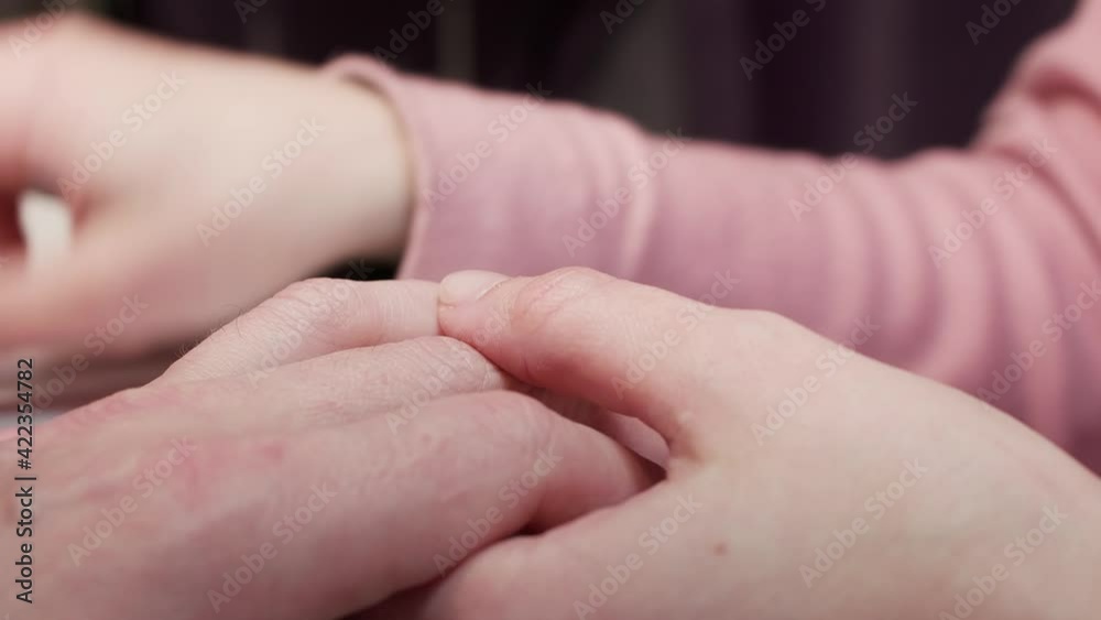 Manicurist files nails on man hand. Close up view Manicurist files nails on man hand. Close up view