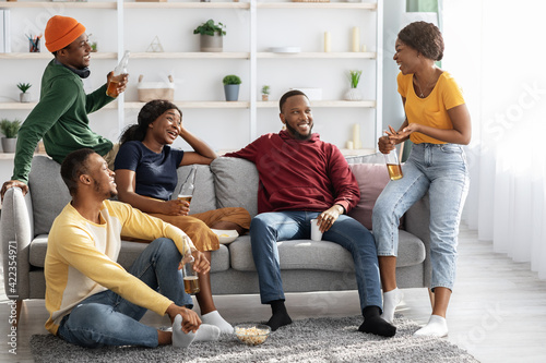 Group Of Black Friends Enjoying Drinks Party At Home