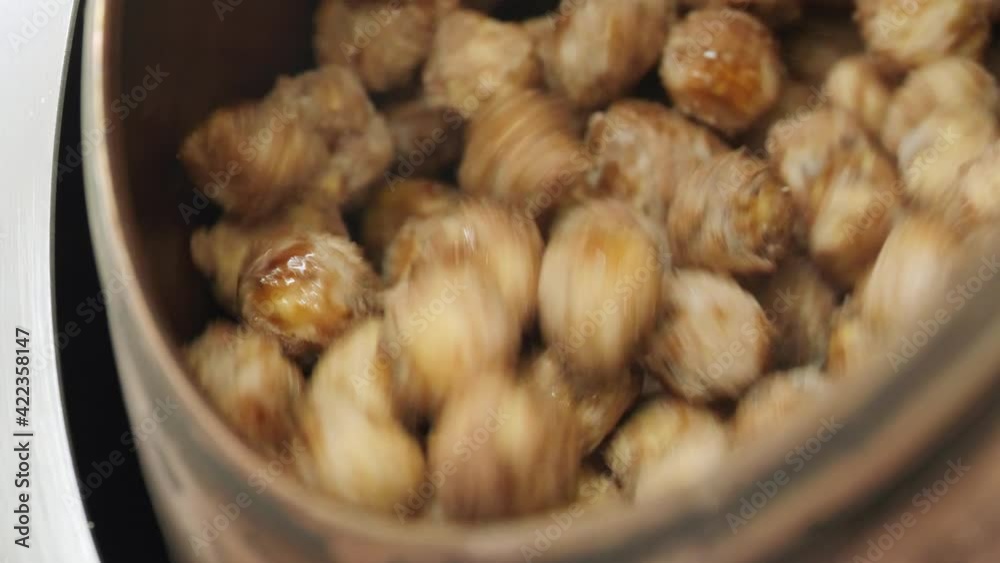 Hazelnuts caramelization at production factory Hazelnuts caramelization at production factory