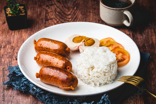 Pinoy Breakfast Meal- Longganisa with Salted Egg and Steamed Rice (center focused)