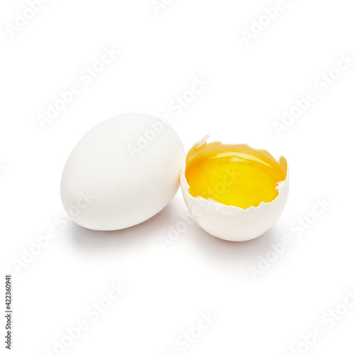 whole egg with half and open yolk isolate on white background