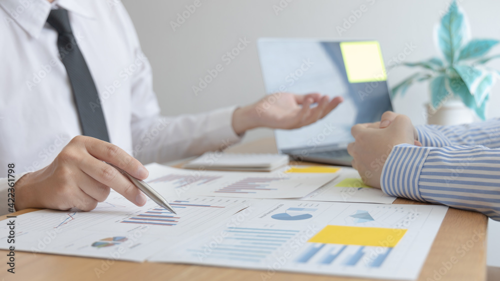 Business team meeting, Marketers and financial accountants are discussing and analyzing charts to plan strategies to meet customer needs, Brainstorming and business discussions. Business team meeting, Marketers and financial accountants are discussing and analyzing charts to plan strategies to meet customer needs, Brainstorming and business discussions.