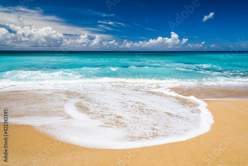 Ocean waves, beach, and blue sky in Taitung, Taiwan. photo